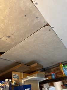 Image of suspected asbestos to the ceiling in a house where we were carrying out a Level 2 RICS Home Survey